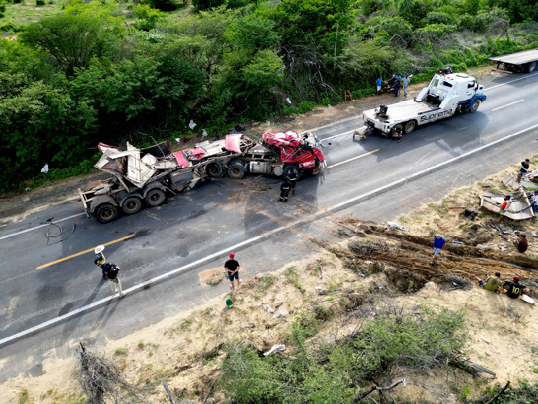 An overhead shot of a red truck accident scene on a highway. P